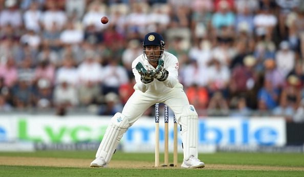 Dhoni receives a throw during England's 3-1 drubbing of India (2014)